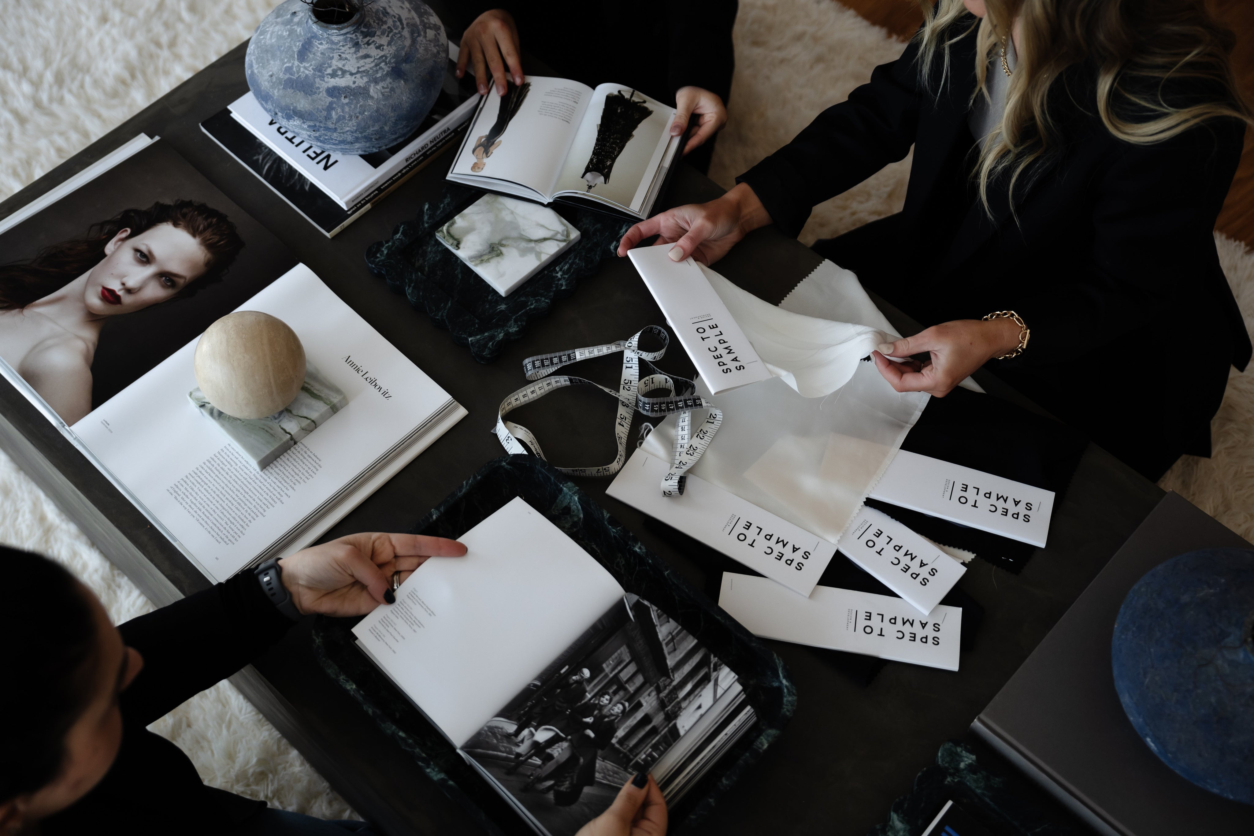 Close-up of sustainable fabric swatches and eco-conscious fashion production layout.